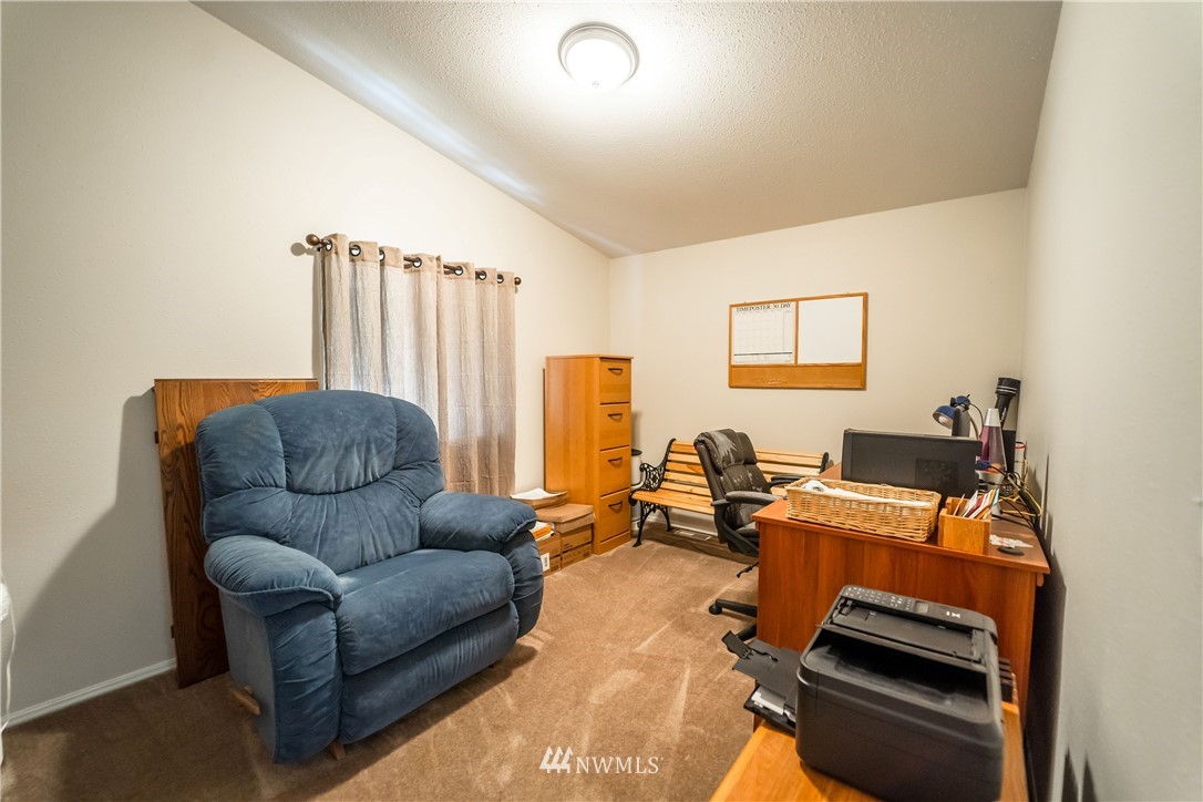 289 Antrim Road Winlock, WA 98596 - Photo 16 of 30 a living room with furniture a flat screen tv and a window