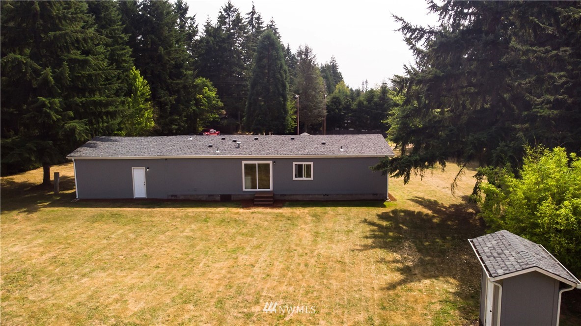 289 Antrim Road Winlock, WA 98596 - Photo 21 of 30 a view of a house with a yard