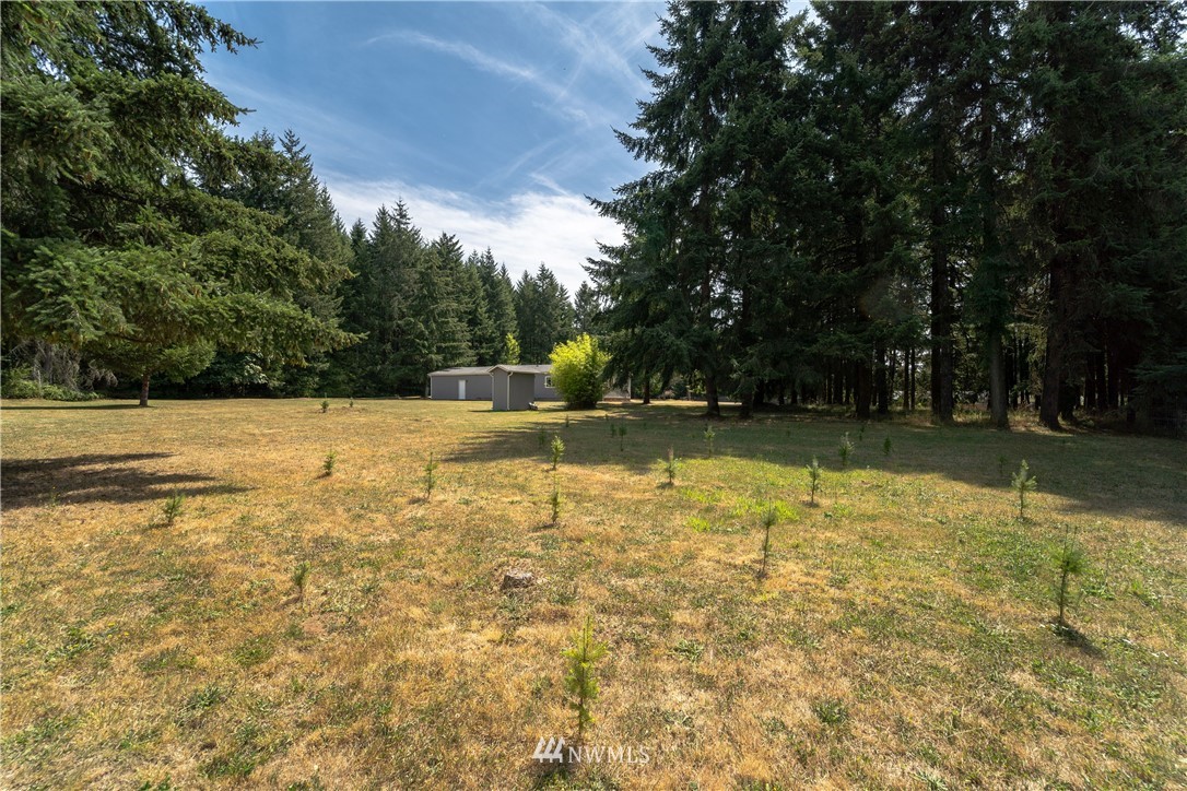289 Antrim Road Winlock, WA 98596 - Photo 24 of 30 a view of a swimming pool with an outdoor space and seating area