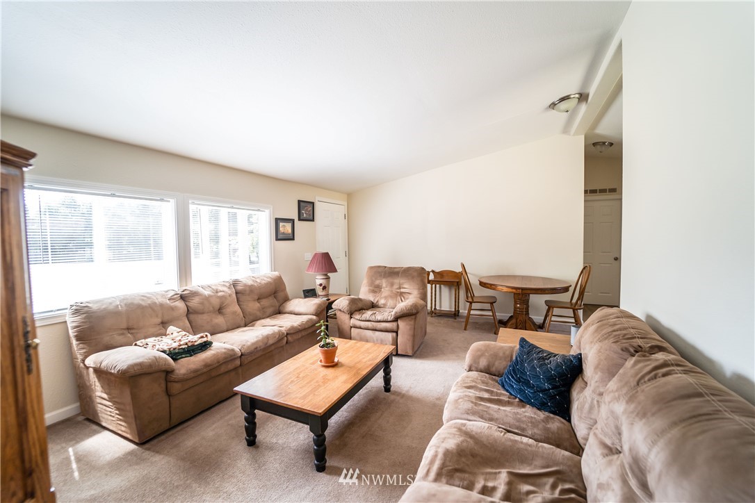 289 Antrim Road Winlock, WA 98596 - Photo 8 of 30 a living room with furniture and a large window