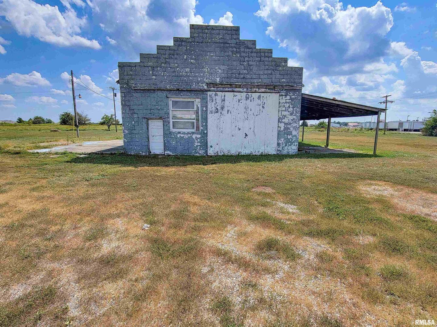 11044 Old Highway 50 Flora, IL 62839 - Photo 16 of 17 a big building with swimming pool in front of it