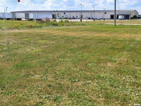 a view of a swimming pool with a yard