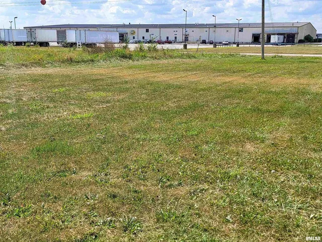 a view of a swimming pool with a yard