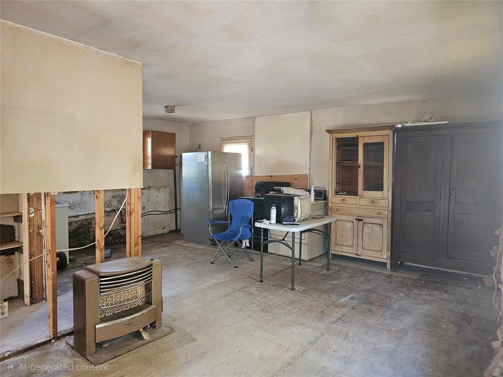 1008 Sixth Street Bangs, TX 76823 - Photo 2 of 24 a living room with furniture and a table