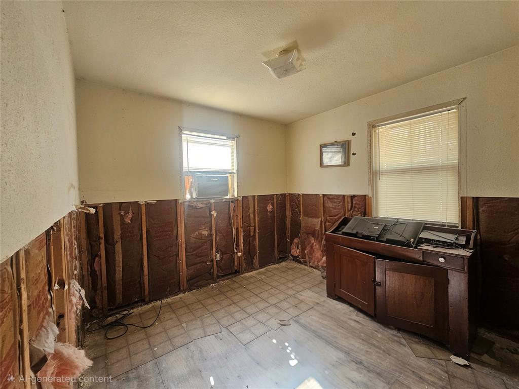1008 Sixth Street Bangs, TX 76823 - Photo 4 of 24 a kitchen with a refrigerator and a stove