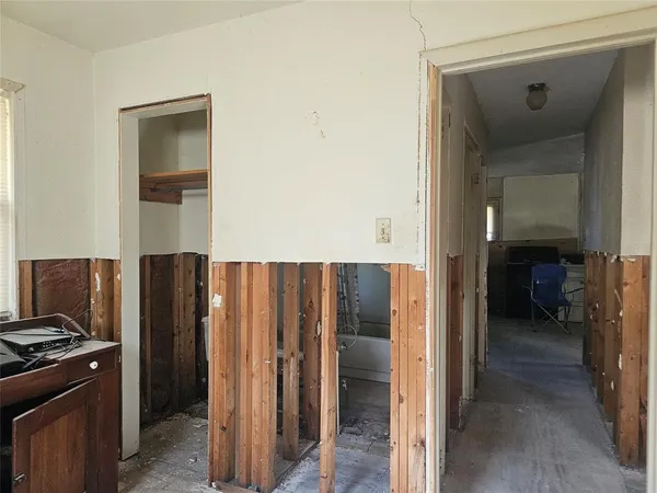 a kitchen with a refrigerator and a stove