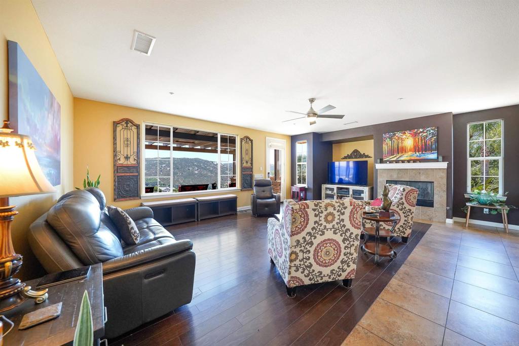 22963 Stokes Road Ramona, CA 92065 - Photo 20 of 57 a living room with furniture and a fireplace