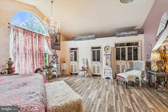 a view of a livingroom with furniture and a window