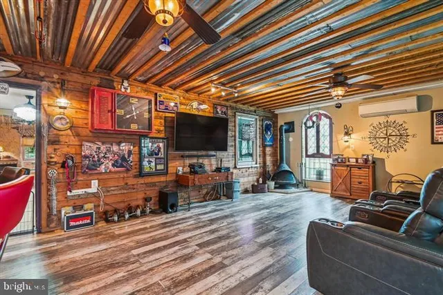a living room with furniture and a flat screen tv