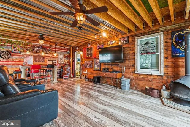 a living room with lots of furniture and a flat screen tv
