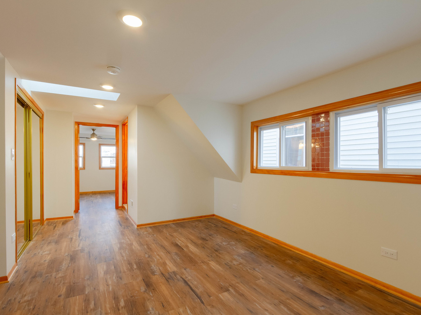 1439 North Springfield Avenue Chicago, IL 60651 - Photo 13 of 35 a view of an empty room with wooden floor and a window