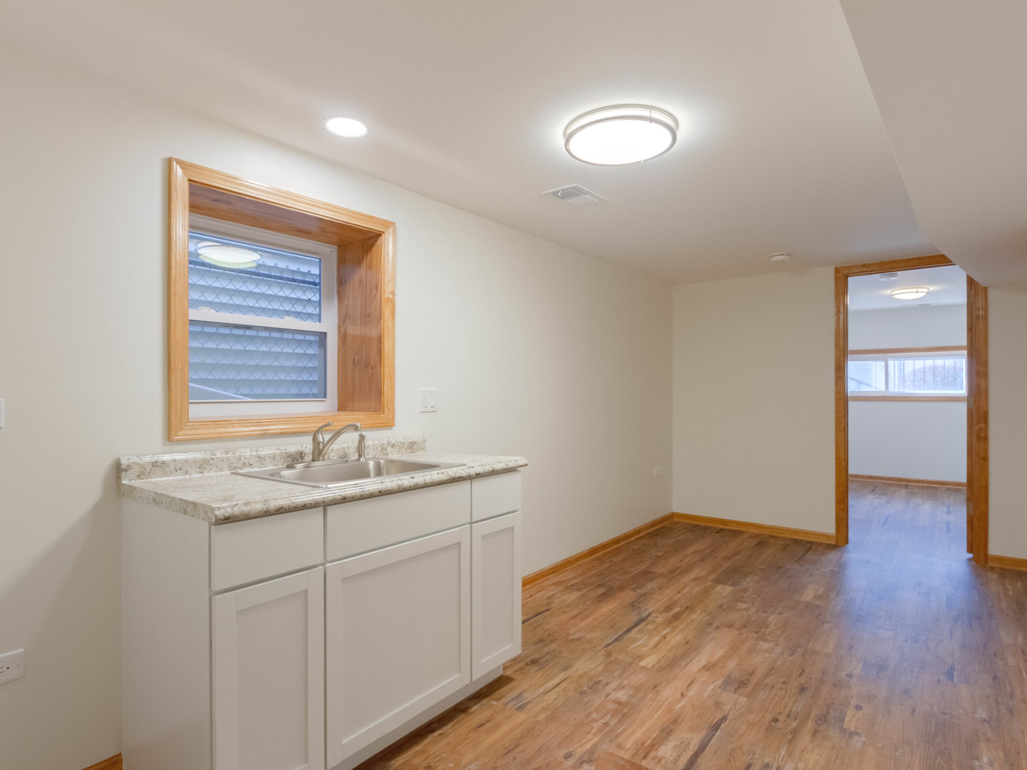 1439 North Springfield Avenue Chicago, IL 60651 - Photo 21 of 35 a room with a sink and mirror