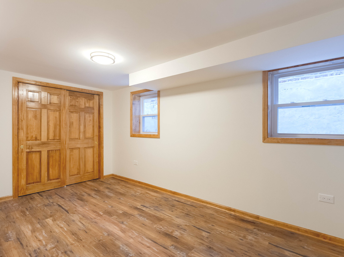 1439 North Springfield Avenue Chicago, IL 60651 - Photo 27 of 35 wooden floor in an empty room with a window