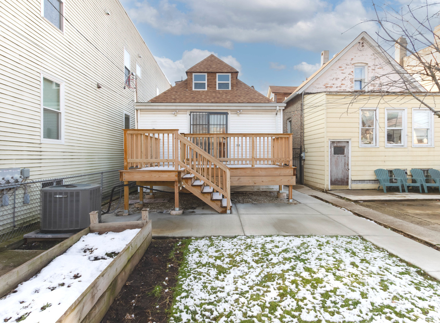 1439 North Springfield Avenue Chicago, IL 60651 - Photo 30 of 35 a front view of a house with a wooden deck