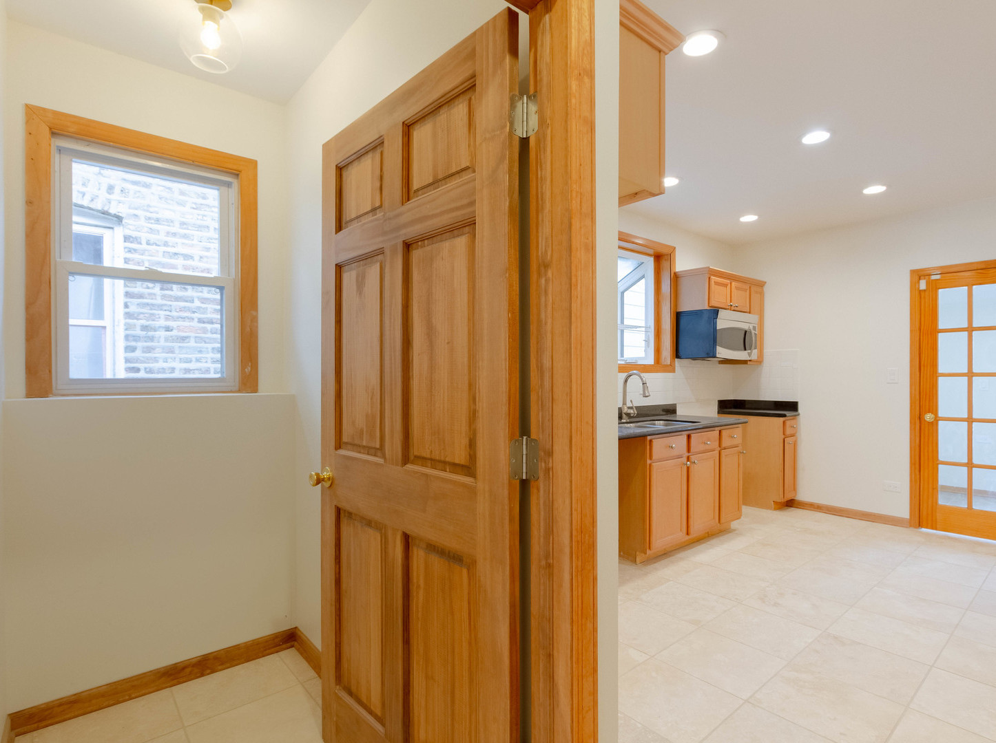 1439 North Springfield Avenue Chicago, IL 60651 - Photo 8 of 35 a view of a kitchen with a refrigerator and a sink