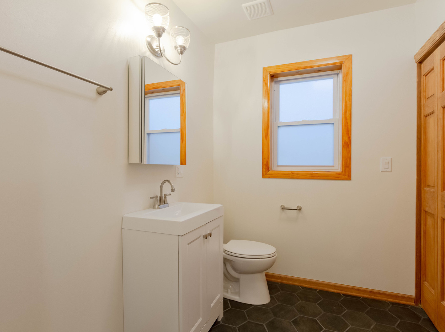 1439 North Springfield Avenue Chicago, IL 60651 - Photo 9 of 35 a bathroom with a sink toilet and mirror