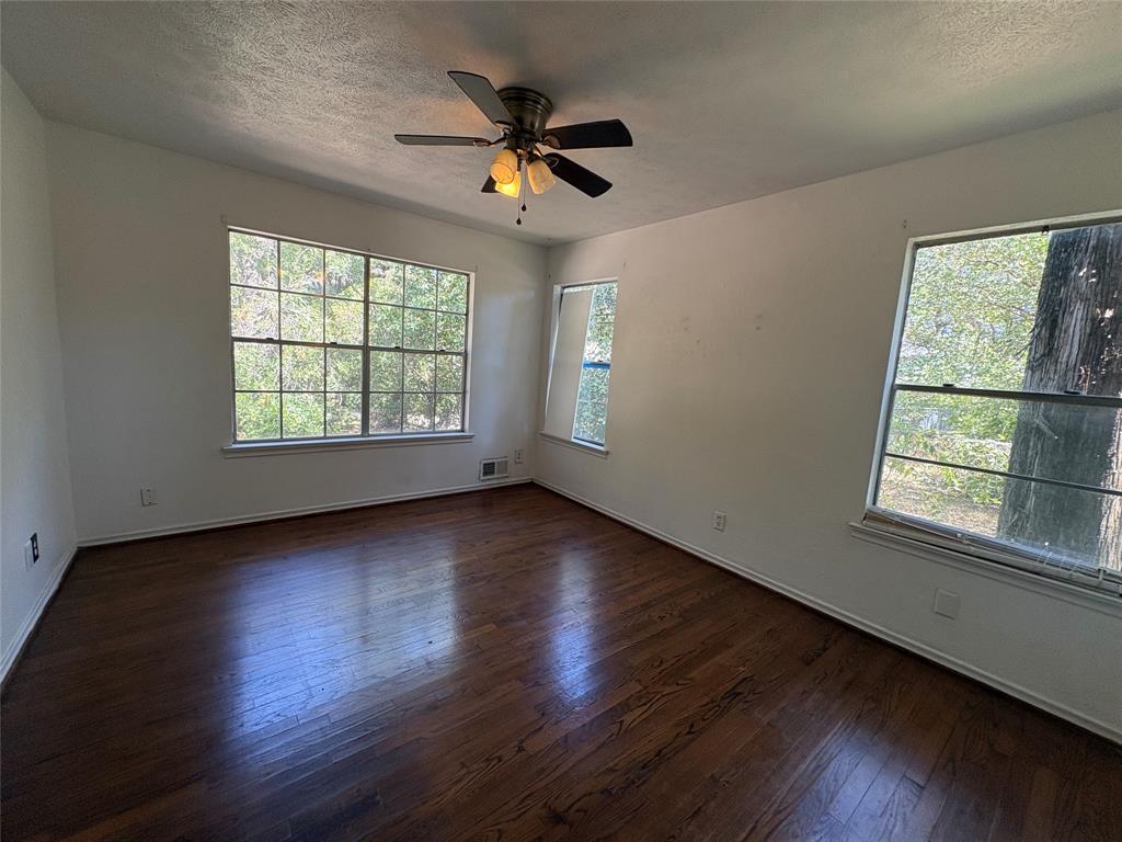 5454 Ranchero Lane Dallas, TX 75236 - Photo 17 of 24 Hardwood flooring, ample natural light, ceiling fan, multiple windows