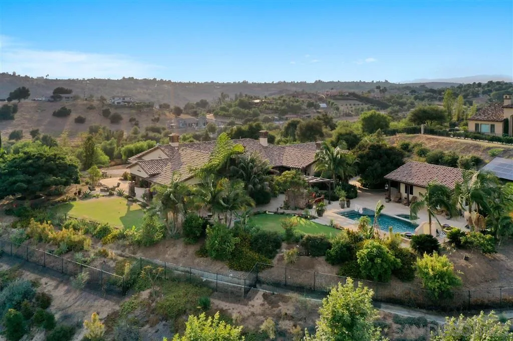 4142 Bridlewood Road Fallbrook, CA 92028 - Photo 2 of 25 an aerial view of green landscape with trees houses and mountain view