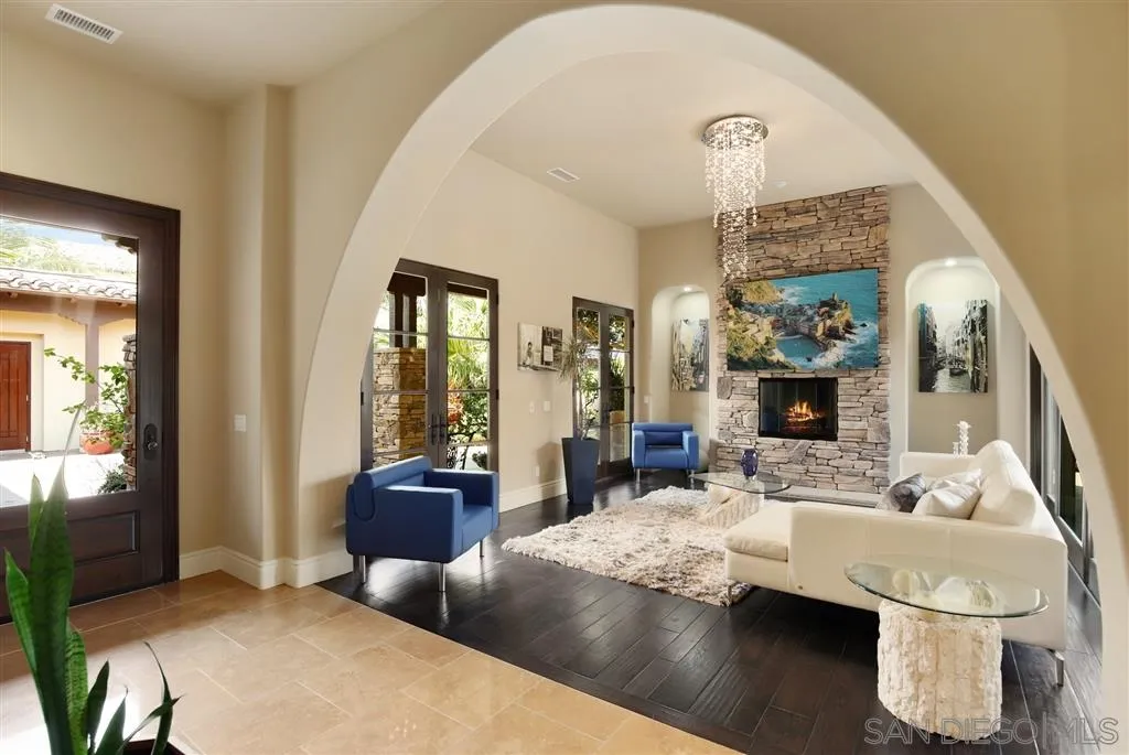 4142 Bridlewood Road Fallbrook, CA 92028 - Photo 4 of 25 a living room with couches and a dining table with wooden floor