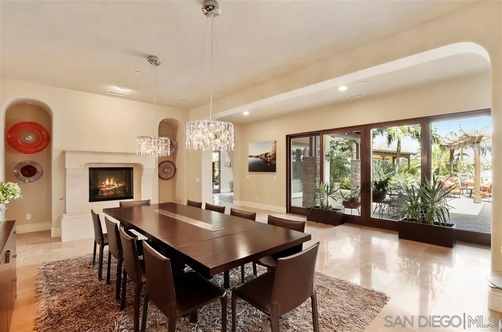 4142 Bridlewood Road Fallbrook, CA 92028 - Photo 6 of 25 a view of a dining room with furniture and a floor to ceiling window