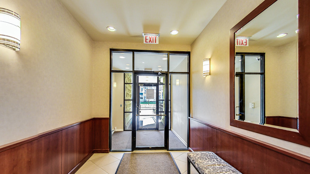 1250 South Indiana Avenue, Unit 802 Chicago, IL 60605 - Photo 2 of 20 a view of entryway with a window and wooden floor