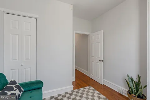 a view of an entryway with wooden floor