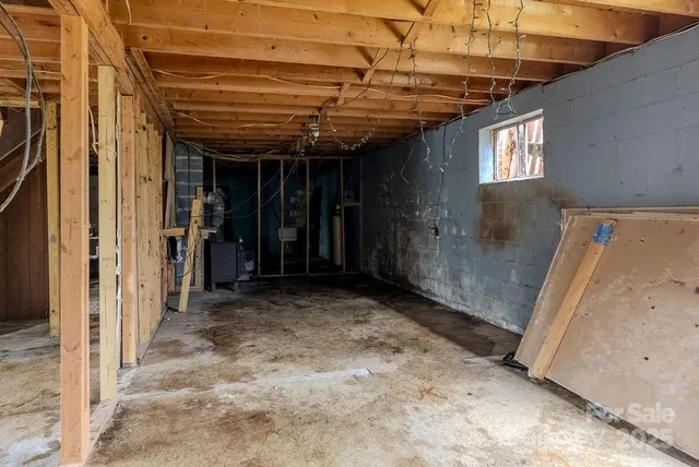 a view of a hallway with wooden walls and windows