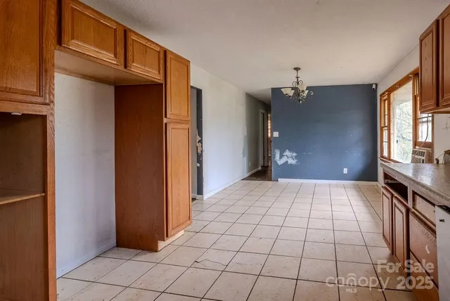 a kitchen with stainless steel appliances granite countertop a sink and a cabinets