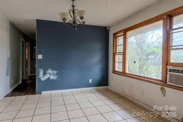a view of a backyard with large trees