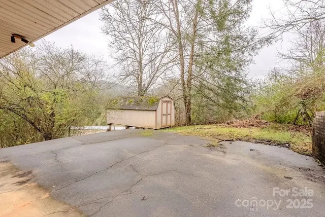 a view of a backyard of the house