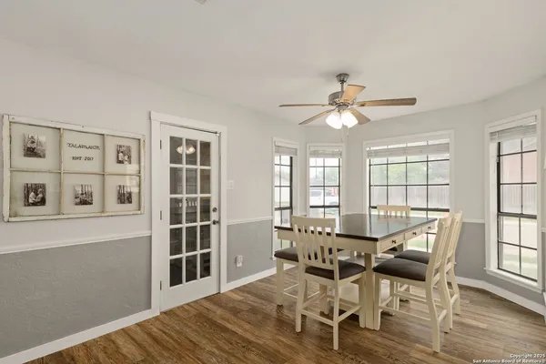 a view of a bathroom with a sink and a mirror