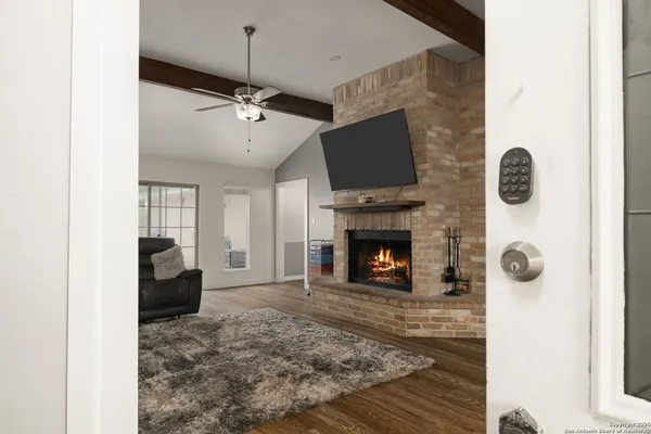 a living room with furniture and a fireplace