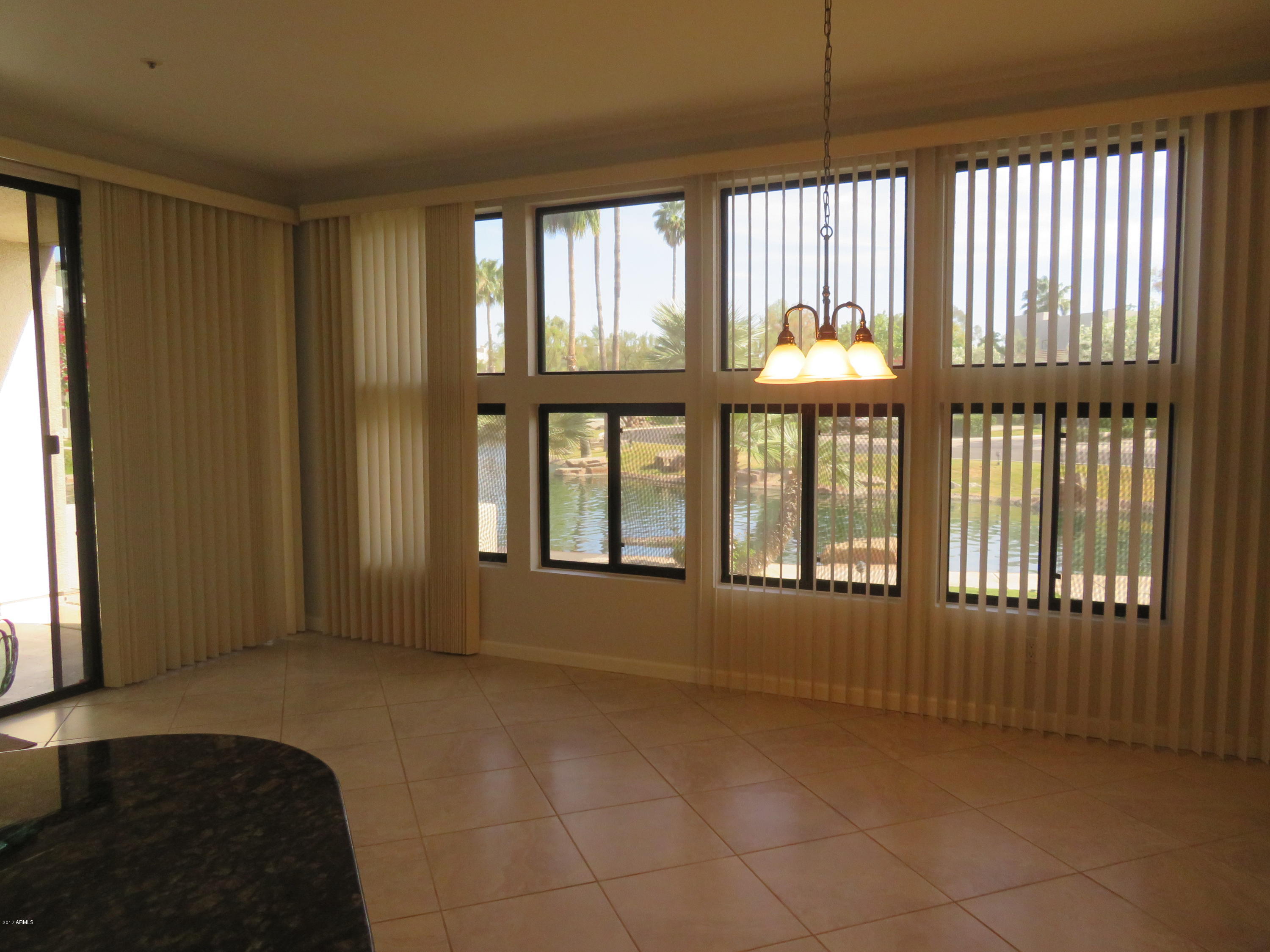 7700 East Gainey Ranch Road, Unit 123 Scottsdale, AZ 85258 - Photo 13 of 40 FAMILY ROOM W WATER VIEW