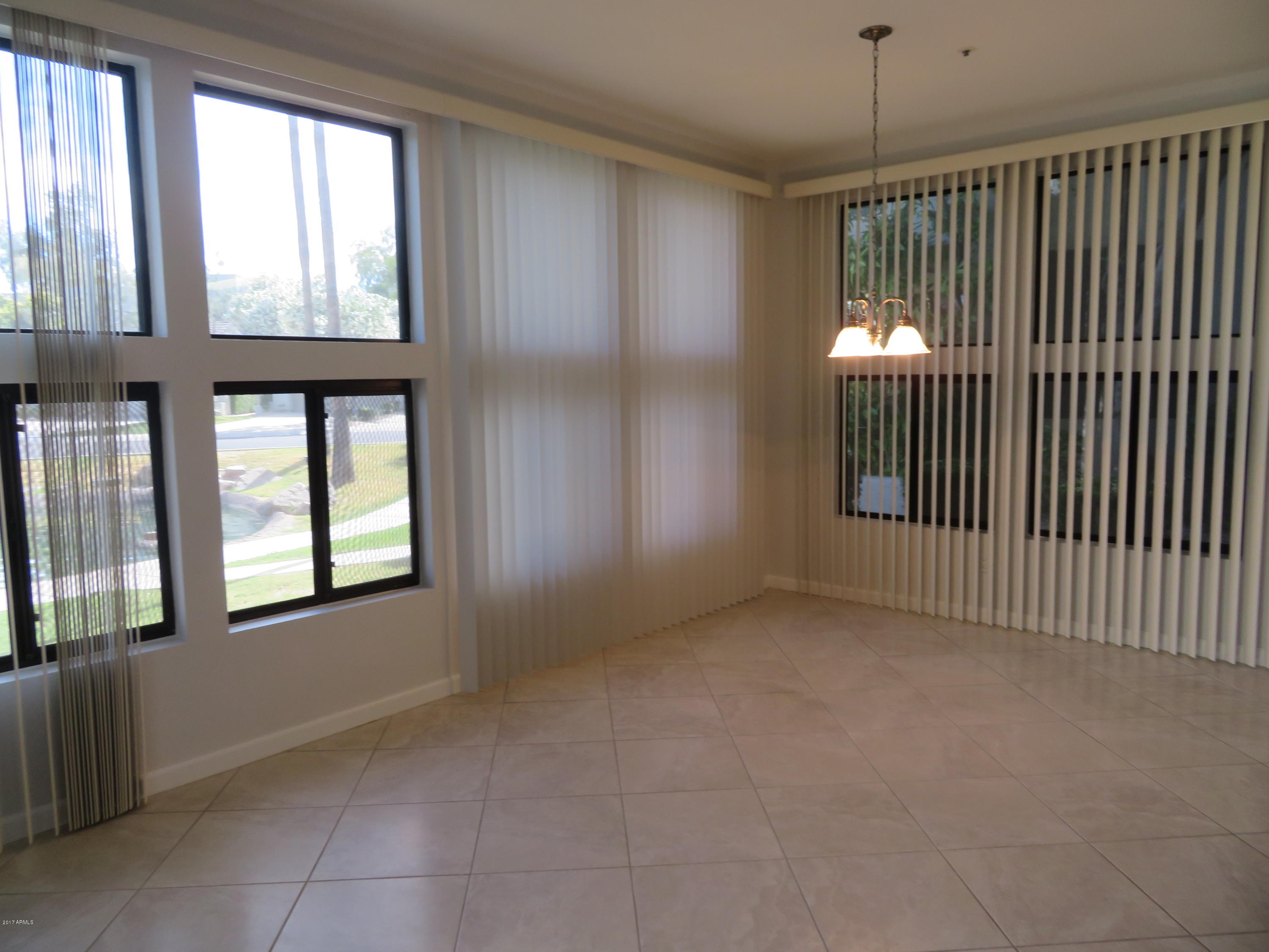 7700 East Gainey Ranch Road, Unit 123 Scottsdale, AZ 85258 - Photo 14 of 40 BRIGHT FAM ROOM