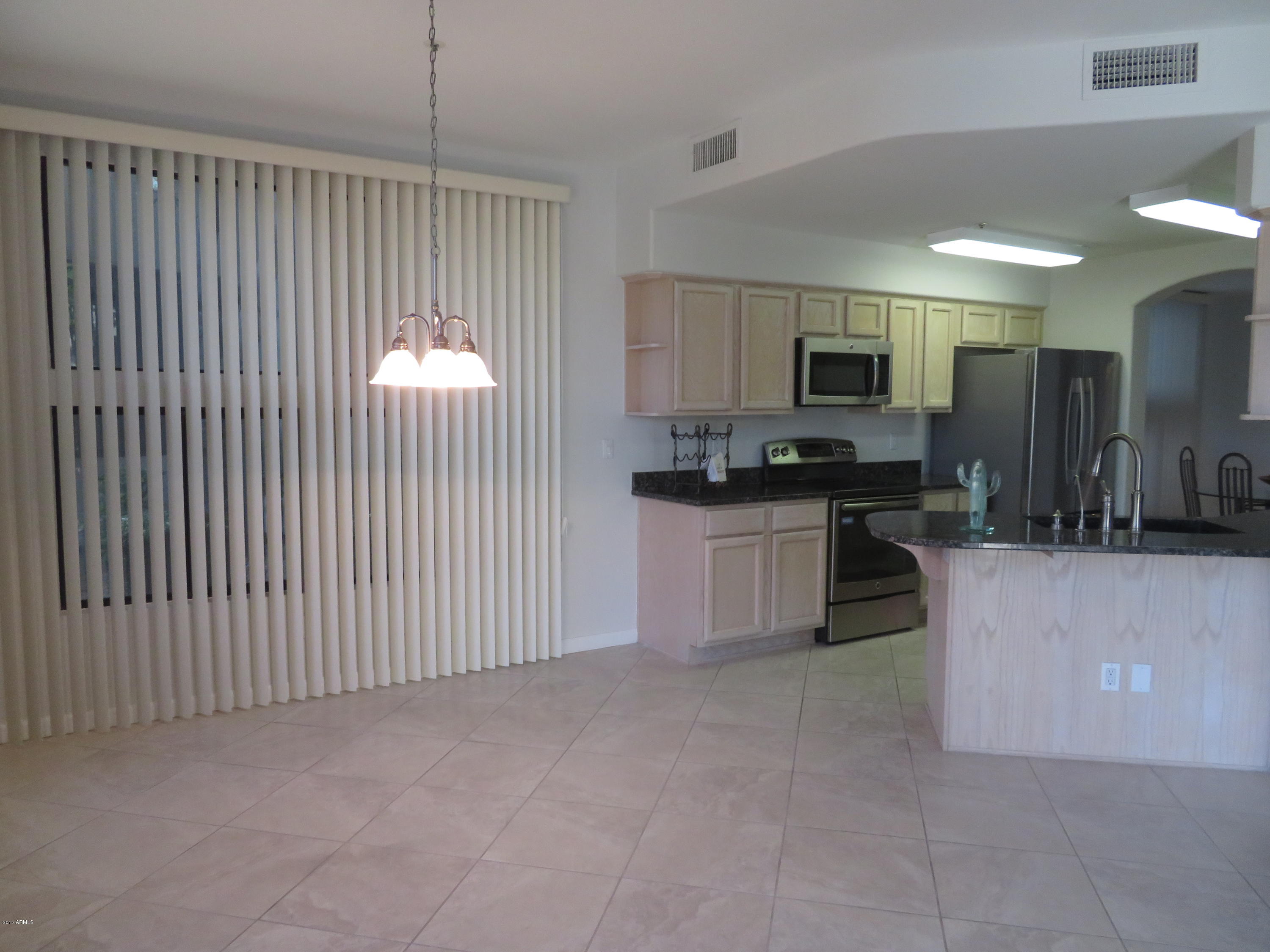 7700 East Gainey Ranch Road, Unit 123 Scottsdale, AZ 85258 - Photo 15 of 40 FAMILY ROOM/KITCHEN