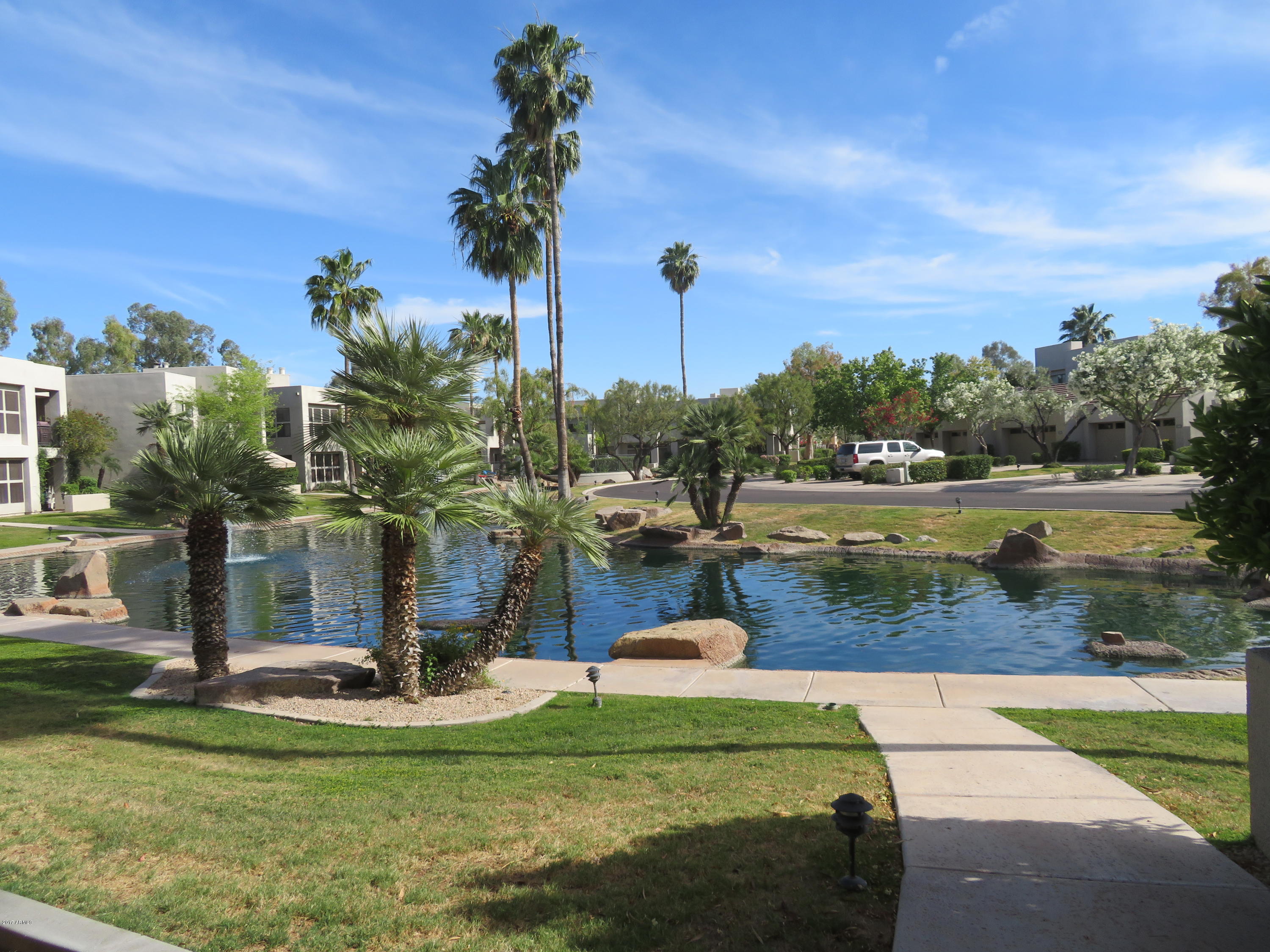 7700 East Gainey Ranch Road, Unit 123 Scottsdale, AZ 85258 - Photo 2 of 40 WATER LAGOON IN FRONT OF UNIT