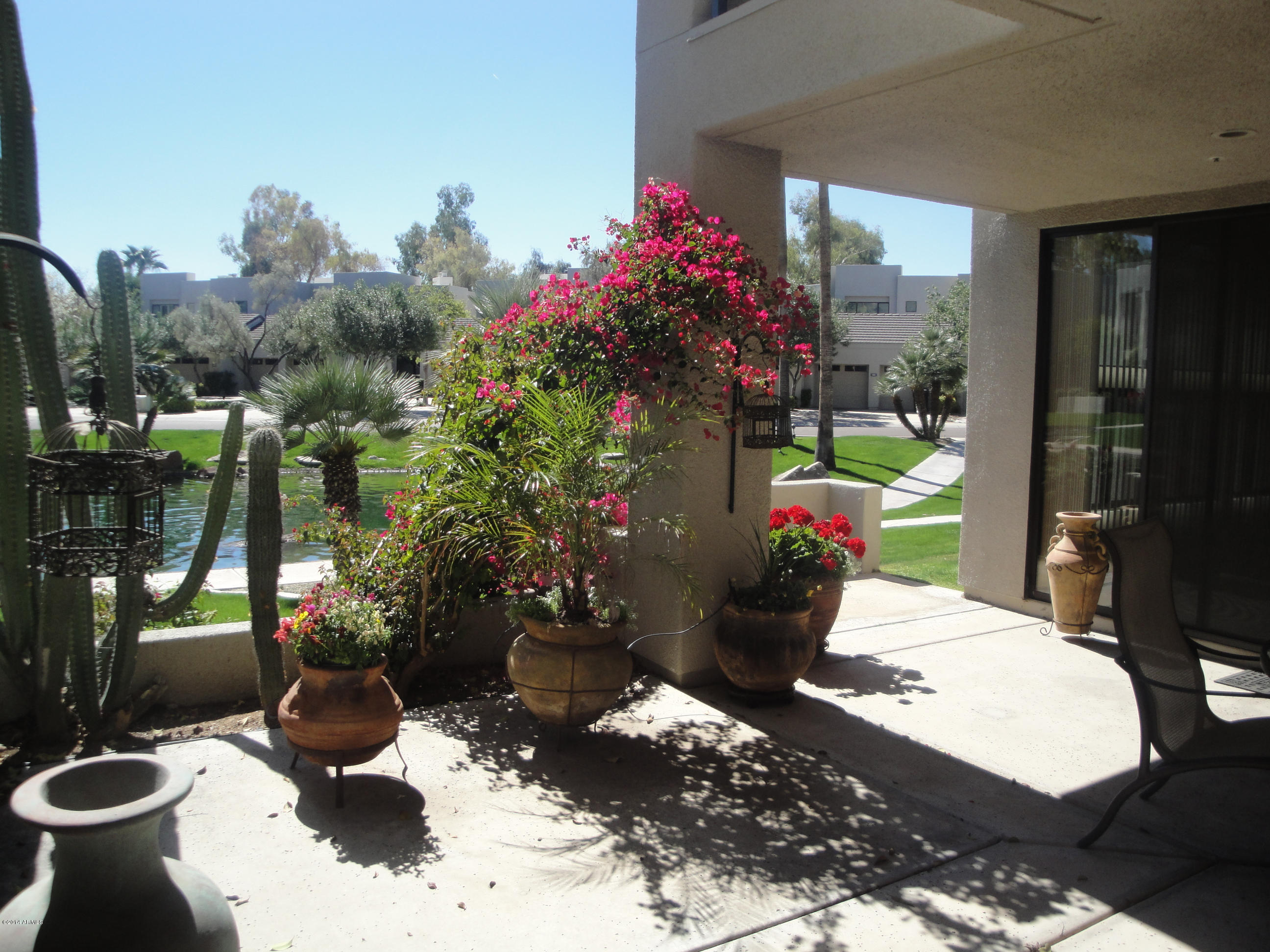 7700 East Gainey Ranch Road, Unit 123 Scottsdale, AZ 85258 - Photo 3 of 40 LAGOON VIEW FROM PATIO