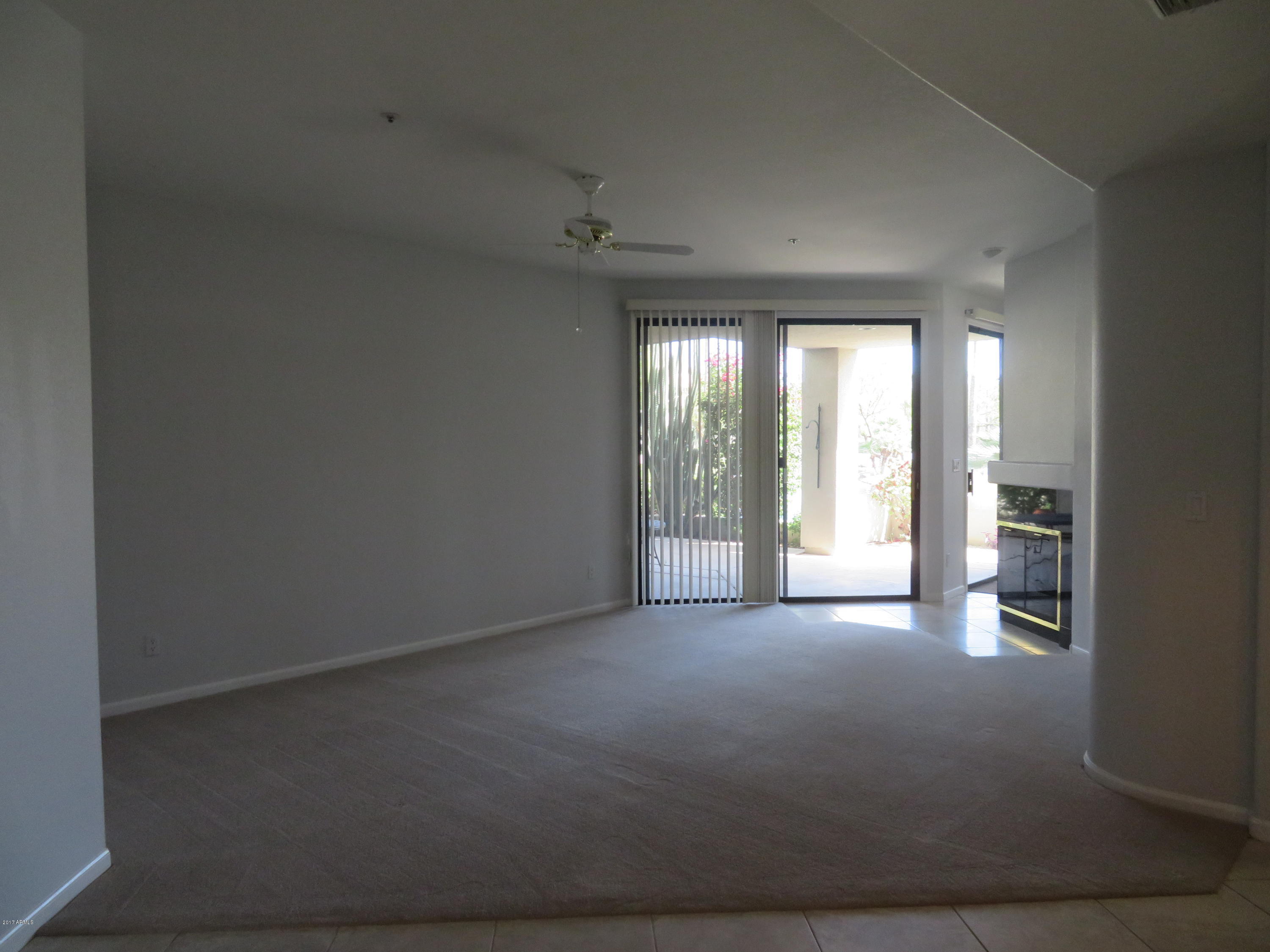 7700 East Gainey Ranch Road, Unit 123 Scottsdale, AZ 85258 - Photo 5 of 40 LIVING ROOM W ACCESS OUT TO PATIO
