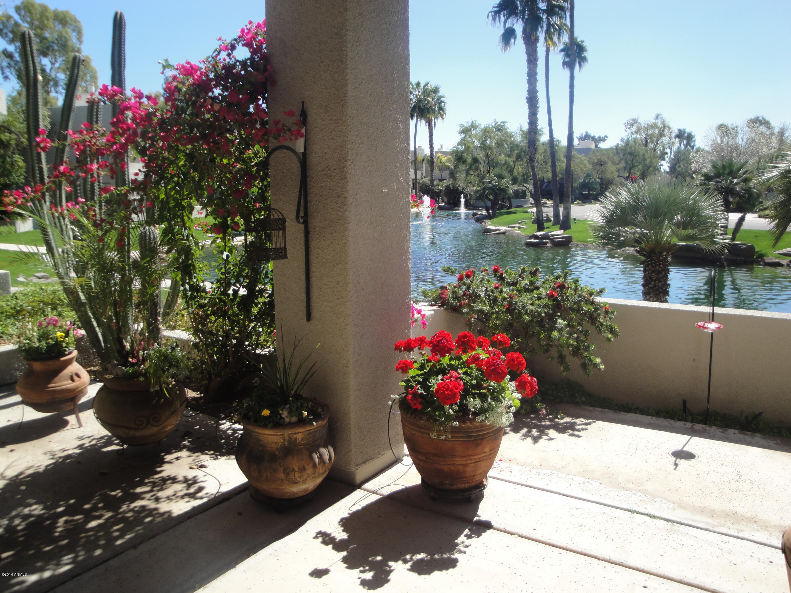7700 East Gainey Ranch Road, Unit 123 Scottsdale, AZ 85258 - Photo 7 of 40 LAGOON VIEW FROM PATIO
