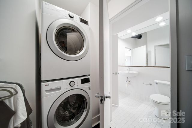 a view of a bathroom with a washer and dryer