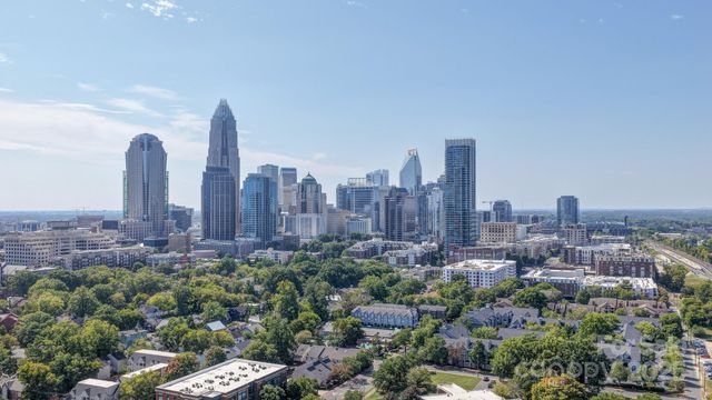 a view of a city with tall buildings