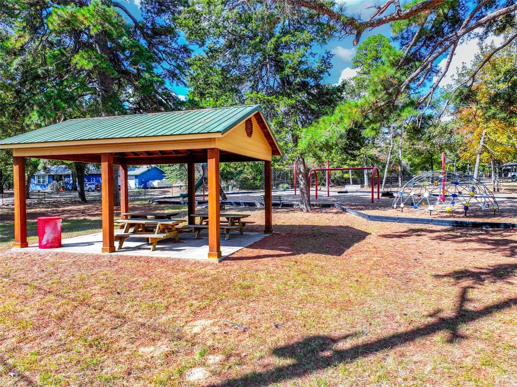 Lot 7 King Sebastian Road Scroggins, TX 75480 - Photo 35 of 40 a view of street with trees and retail shops