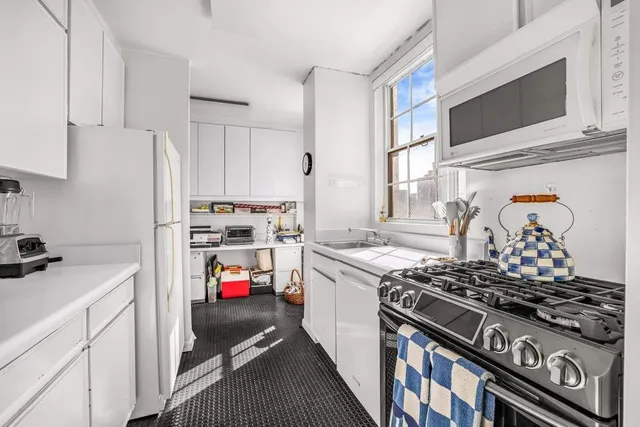a view of a livingroom with a white walls