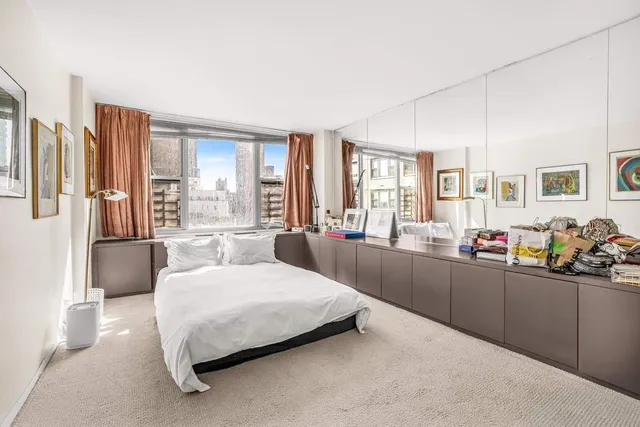 a kitchen with kitchen island granite countertop a stove and a sink