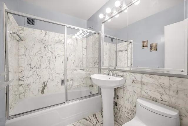 a bedroom with a bed and a closet