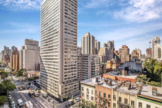 a room with furniture a rug and a window