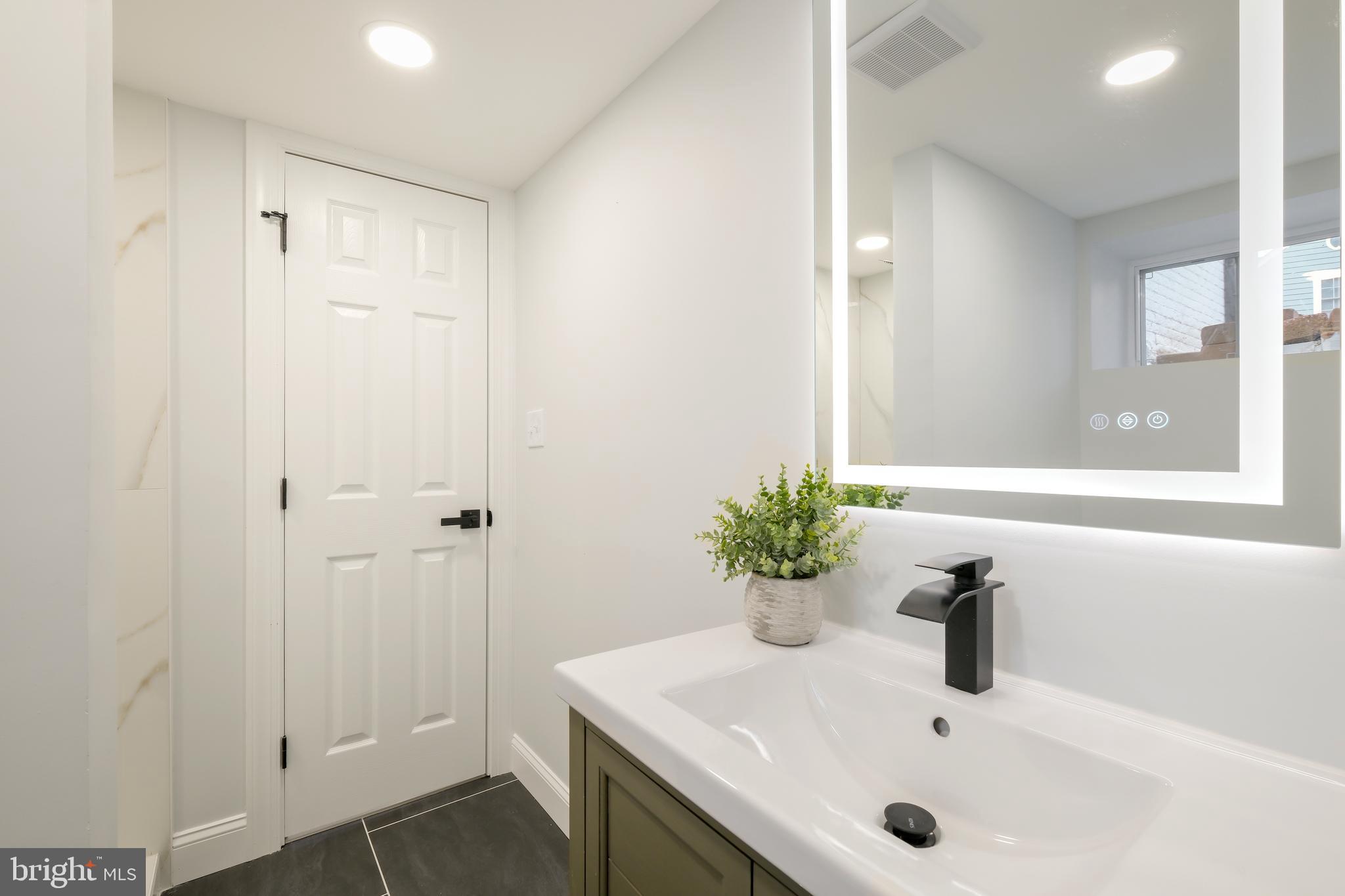617 Greenbrier Drive Silver Spring, MD 20910 - Photo 15 of 60 a bathroom with a sink and a window