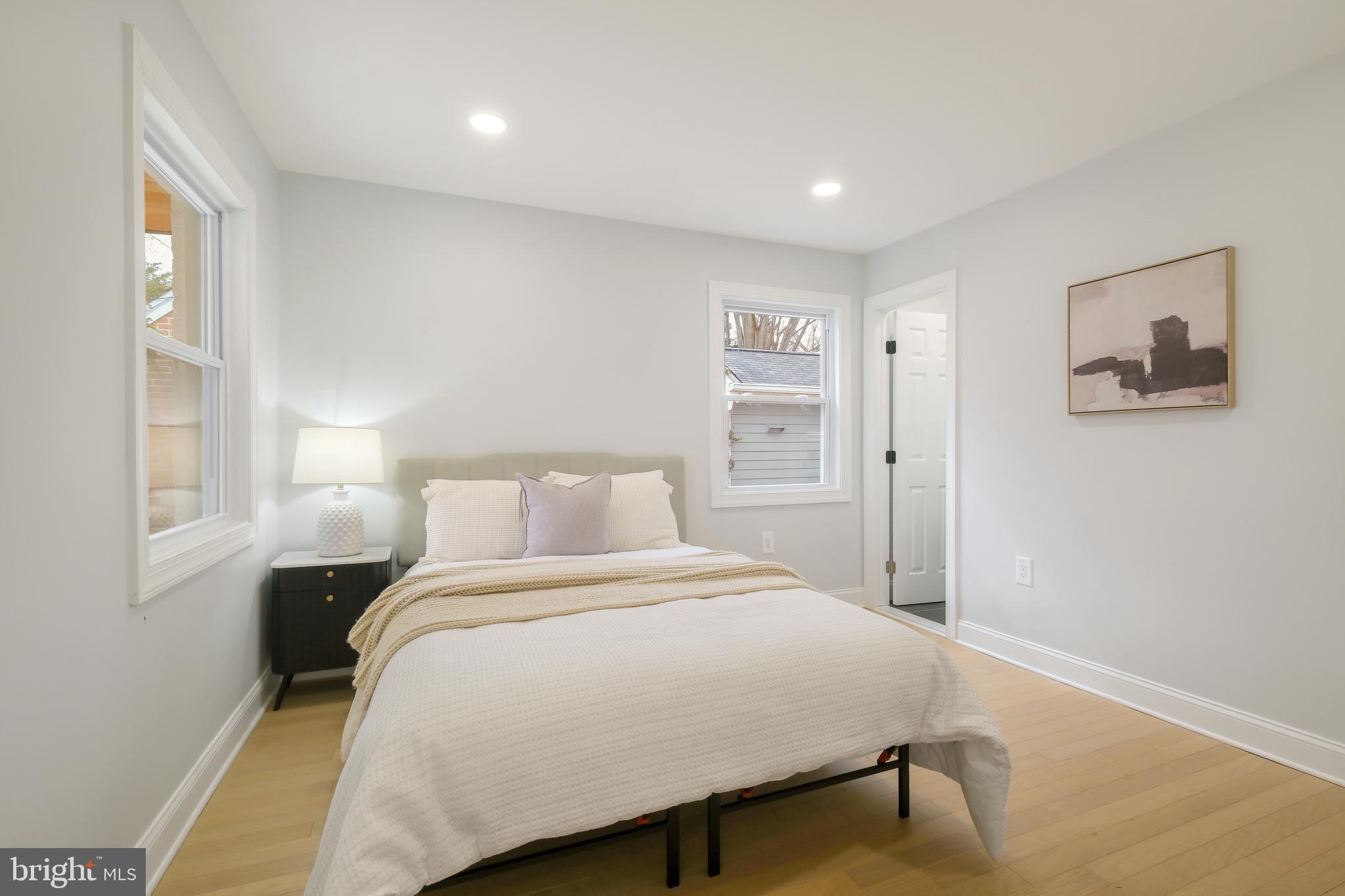 617 Greenbrier Drive Silver Spring, MD 20910 - Photo 18 of 60 a bedroom with a bed and a painting