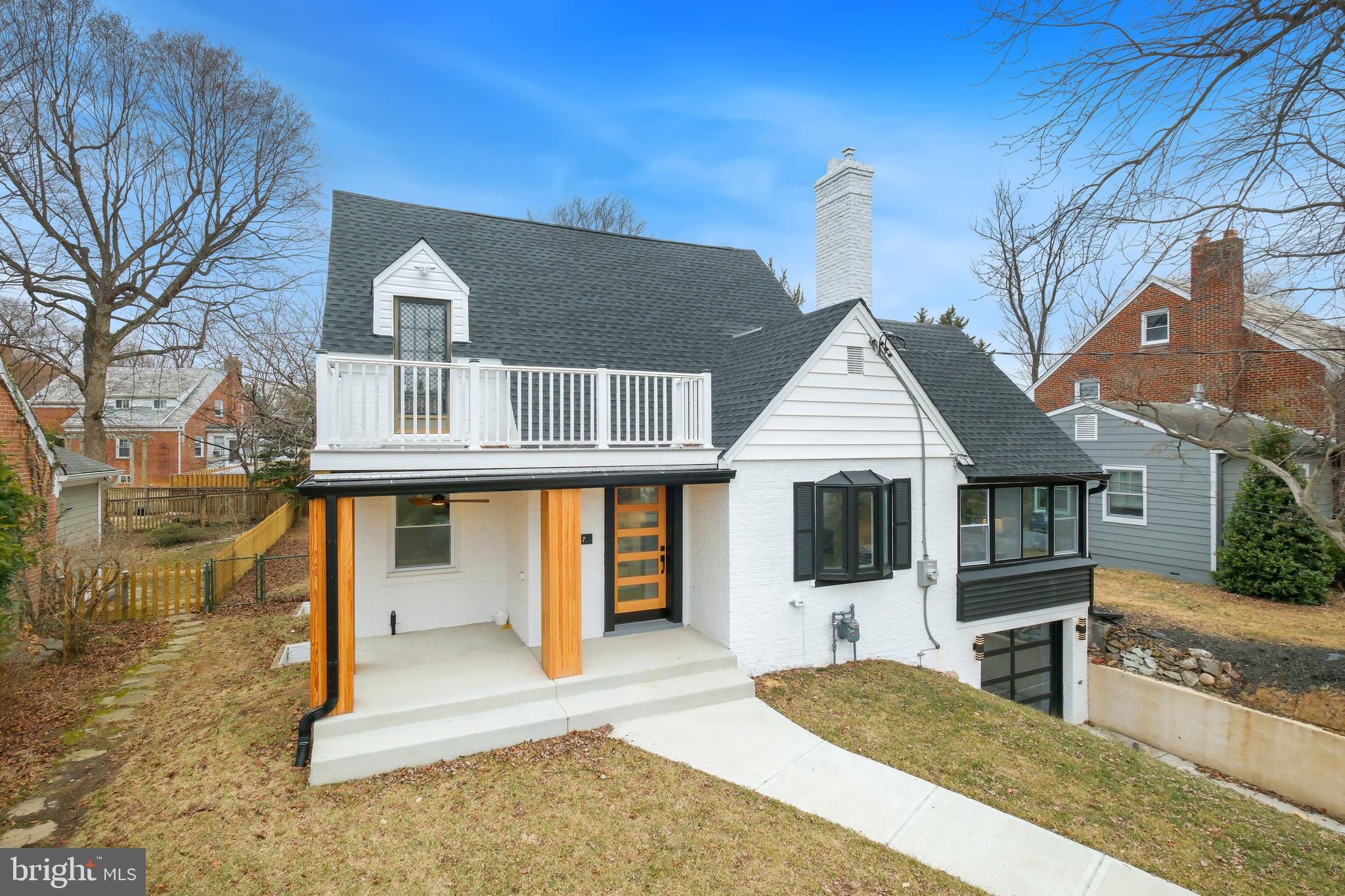 617 Greenbrier Drive Silver Spring, MD 20910 - Photo 2 of 60 a front view of a house with a yard
