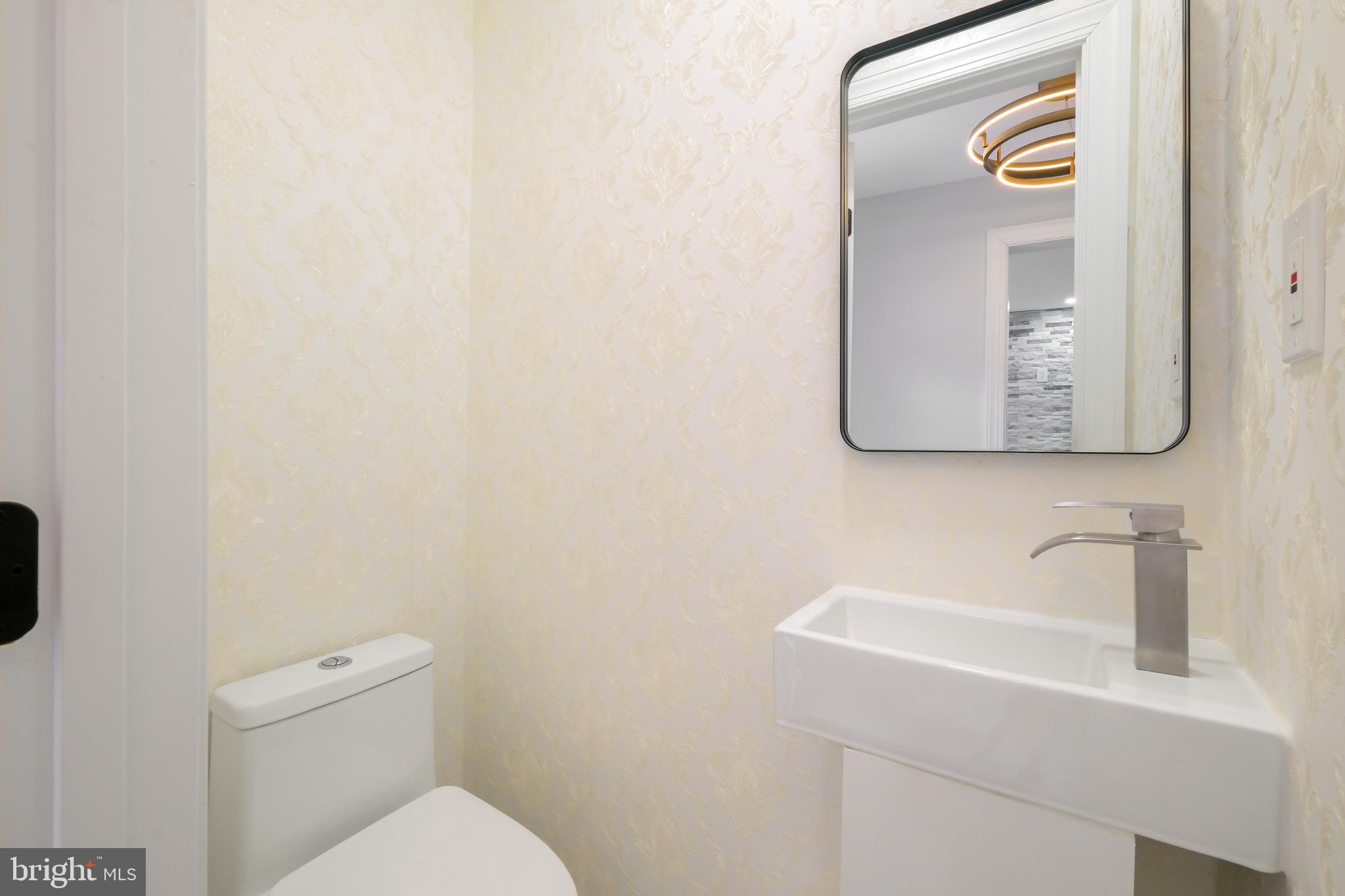 617 Greenbrier Drive Silver Spring, MD 20910 - Photo 27 of 60 a bathroom with a sink and a toilet